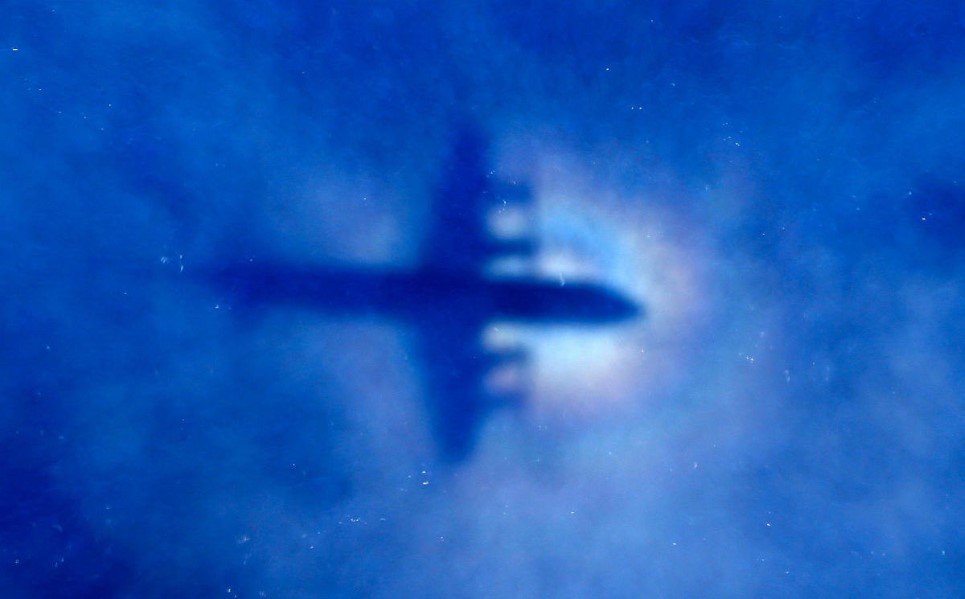 13. The shadow of a Royal New Zealand Air Force (RNZAF) P3 Orion maritime search aircraft is seen on low-level clouds as it flies over the southern Indian Ocean lookin
