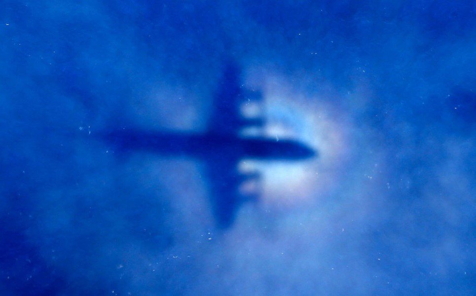 13. The shadow of a Royal New Zealand Air Force (RNZAF) P3 Orion maritime search aircraft is seen on low-level clouds as it flies over the southern Indian Ocean lookin
