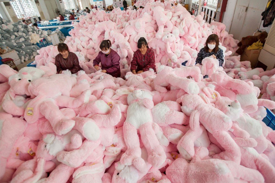 16. Employees manufacture toys at a workshop in Lianyungang, China - October 30, 2014.