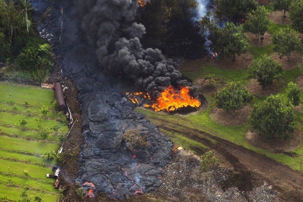 17. Lava flows from the Kilauea Volcano towards the town of Pahoa, Hawaii - June 27, 2014.