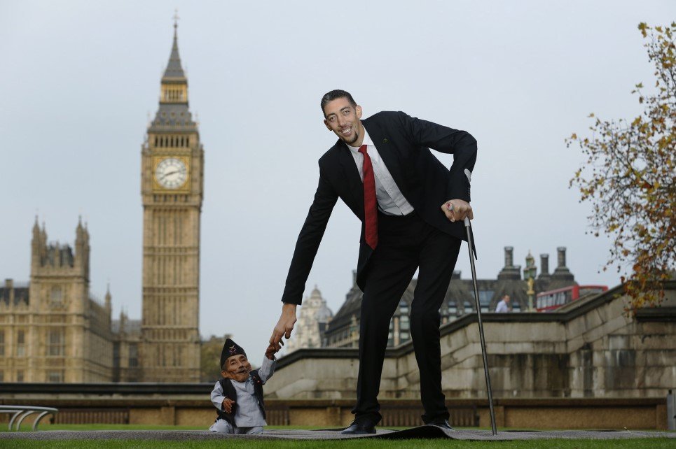 31. The world’s tallest living man, Sultan Kosen and world’s shortest man Chandra Bahadur Dangi greet each other at the Guinness World Records Day in London - November