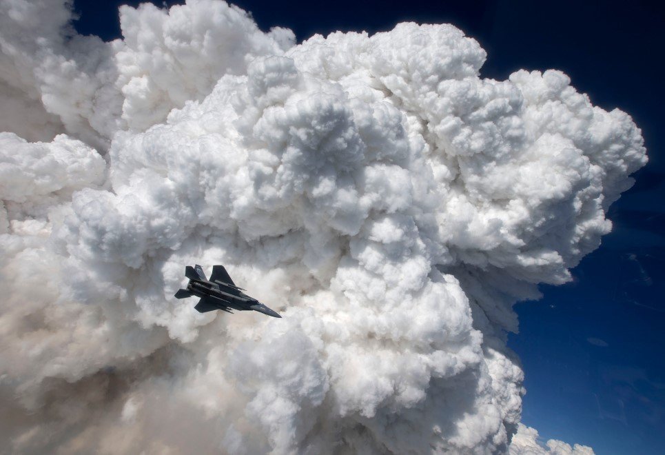 35. An F-15C captured against thick clouds formed by the Oregon Gulch wildfire.