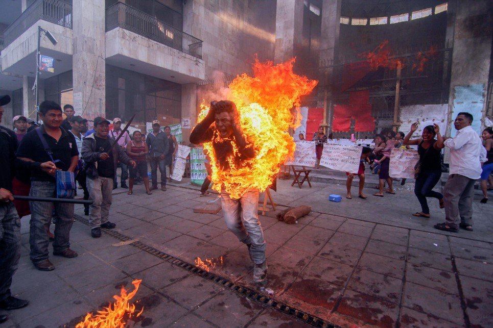 36. Agustin Gomez Perez; a 21 year old farmer sets himself on fire to stage a protest outside the Chiapas state legislature in Tuxtla Gutierrez, Mexico - December 5, 2