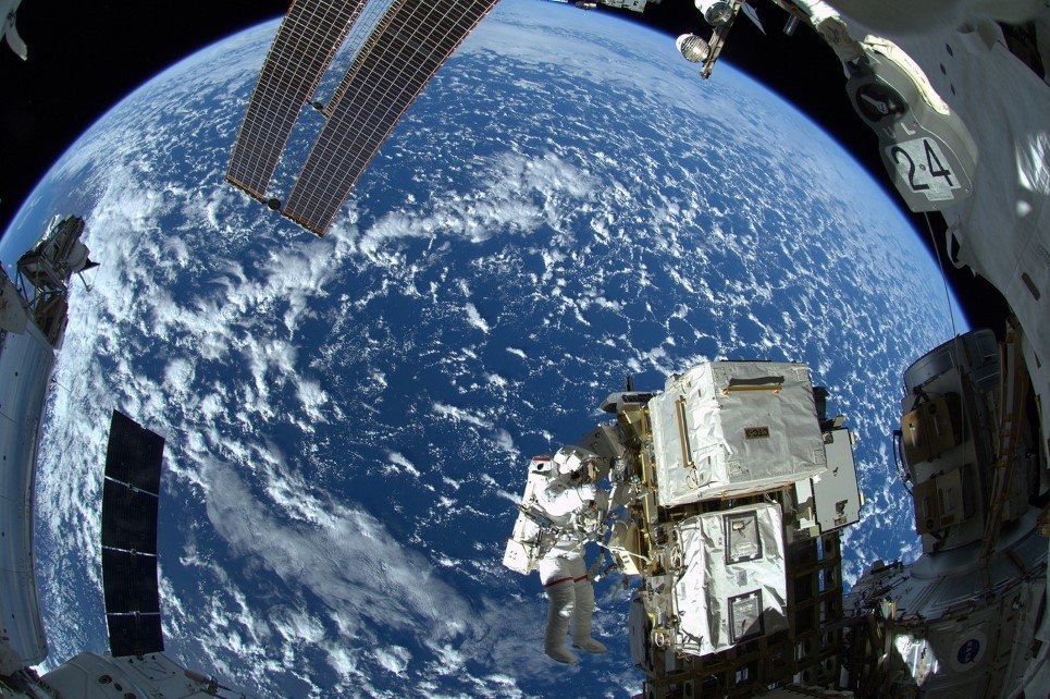52. Astronaut Reid Wiseman works outside the space station’s Quest airlock for the Expedition 41 crew aboard the International Space Station - October 8, 2014.