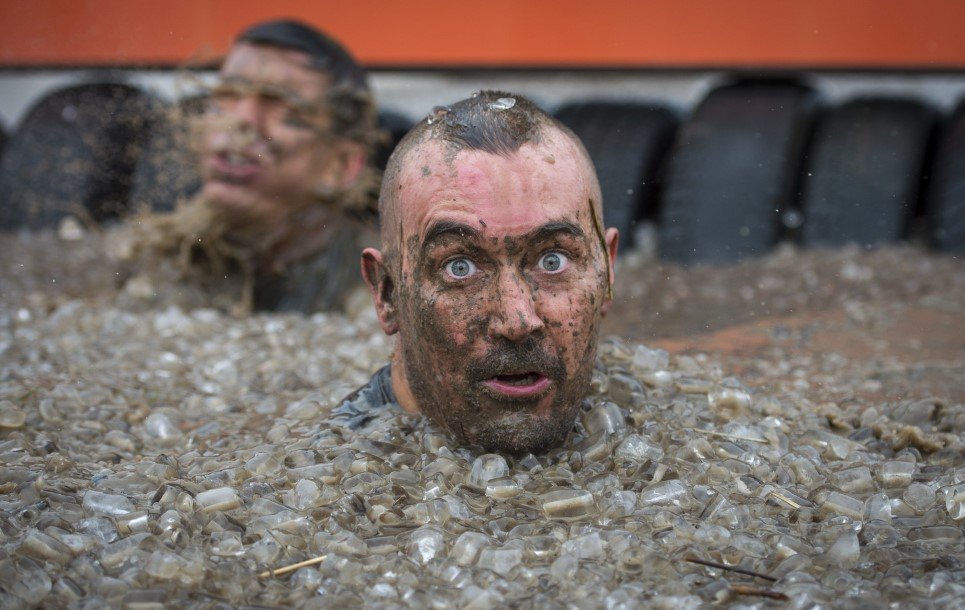 83. Competitors take part in the Tough Mudder London South in Winchester, England - October 25, 2014.
