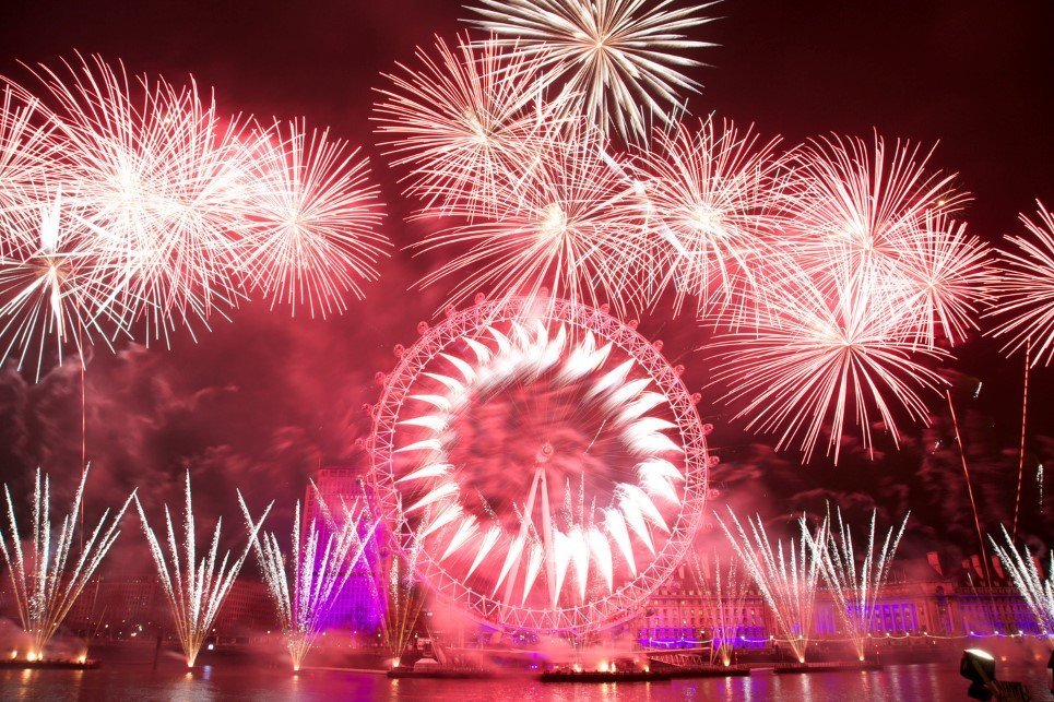 Fireworks over the iconic London Eye marking the coming of the New Year in Central London, Britain, 01 January 2013. Over 250,000 people were expected to take part in the festivities on the banks of the river Thames. EPA/GEORGE HENTON