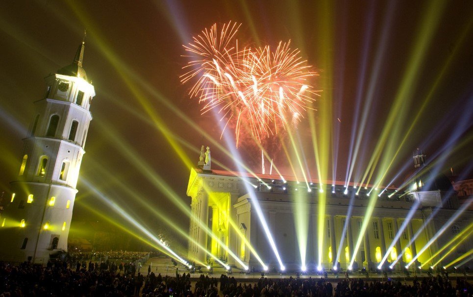 Fireworks light the sky above the Cathedral Square in Vilnius shortly after midnight, greeting the New Year, Thursday, Jan. 1, 2009. Thousands of people celebrated the beginning of the New Year 2009 in the Lithuanian capital. Berlin's light artist Gert Hof, who also showed his work during the opening of the Sydney Olympics 2000 and during a show in New York's Central Park, created this light show.The light performance by Gert Hof opens programme Vilnius-European Capital of Culture 2009 and celebrates the Millennium of Lithuania's Name. (AP Photo/Mindaugas Kulbis)