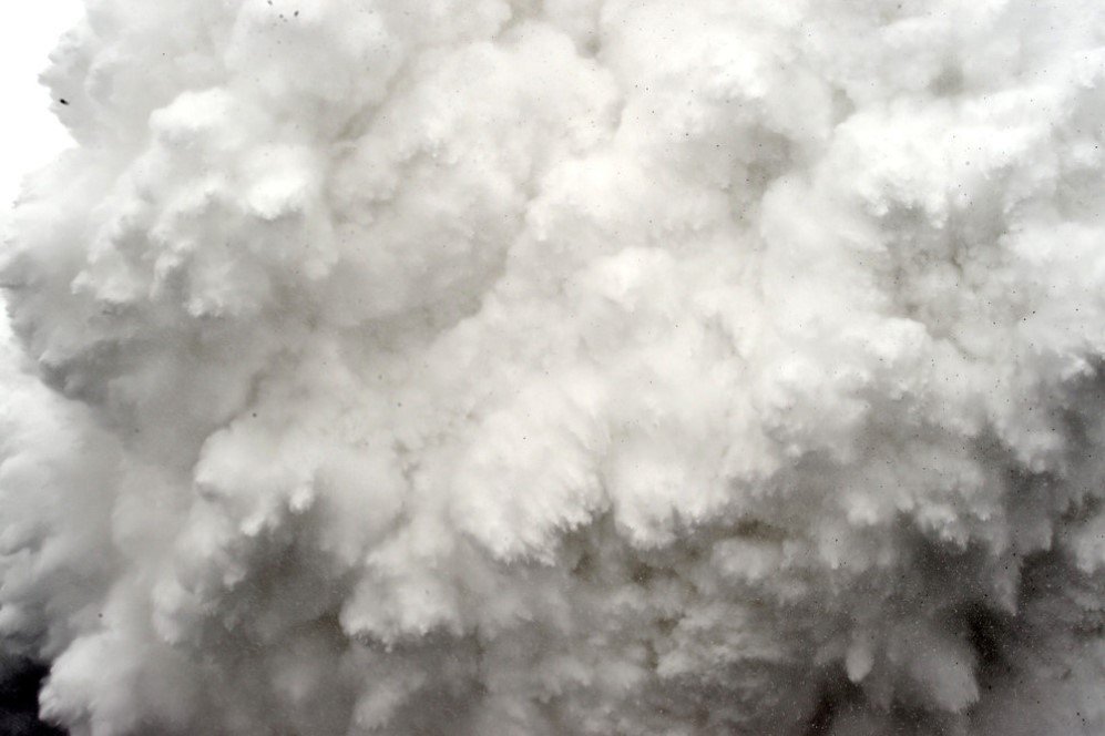 A cloud of snow and debris triggered by an earthquake flies toward Everest Base Camp, moments ahead of flattening part of the camp in the Himalayas.