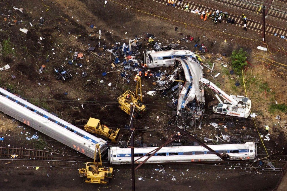 Rescue workers examine the debris of a derailed Amtrak train in Philadelphia, Pennsylvania, which killed 8 people – May 13, 2015