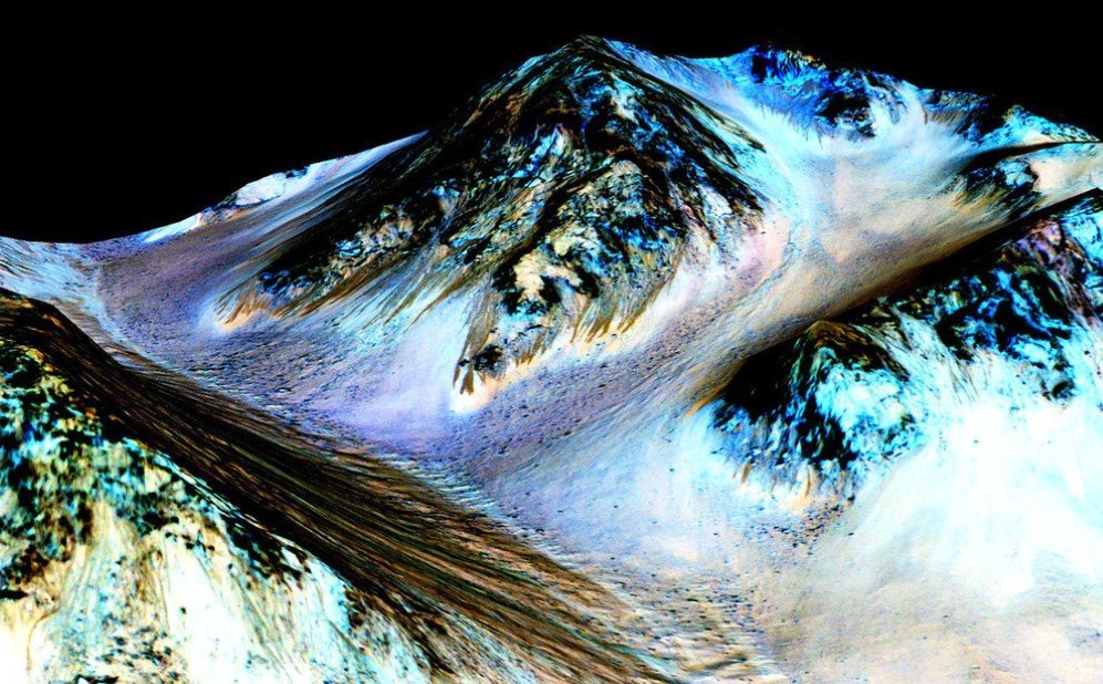 The picture shows what appears to be 100-meter-long streaks on the surface of Mars, seeming to have been formed by flowing water. – Sept. 28, 2015