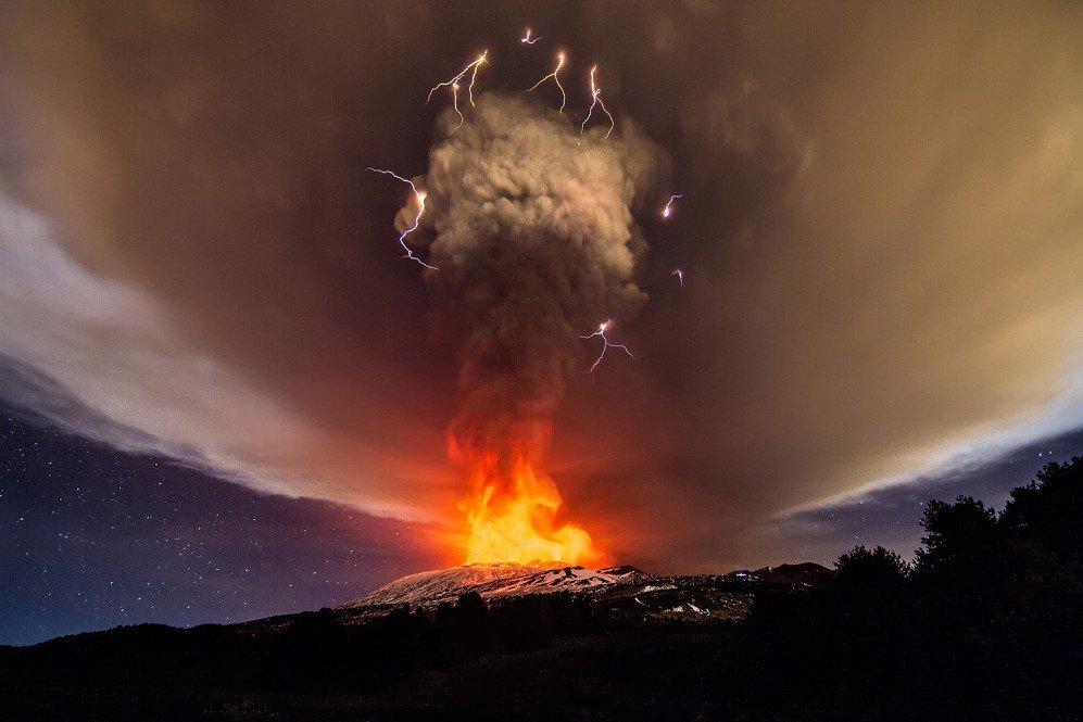 A thunderstorm with volcanic lightning seen as Mount Etna erupts.