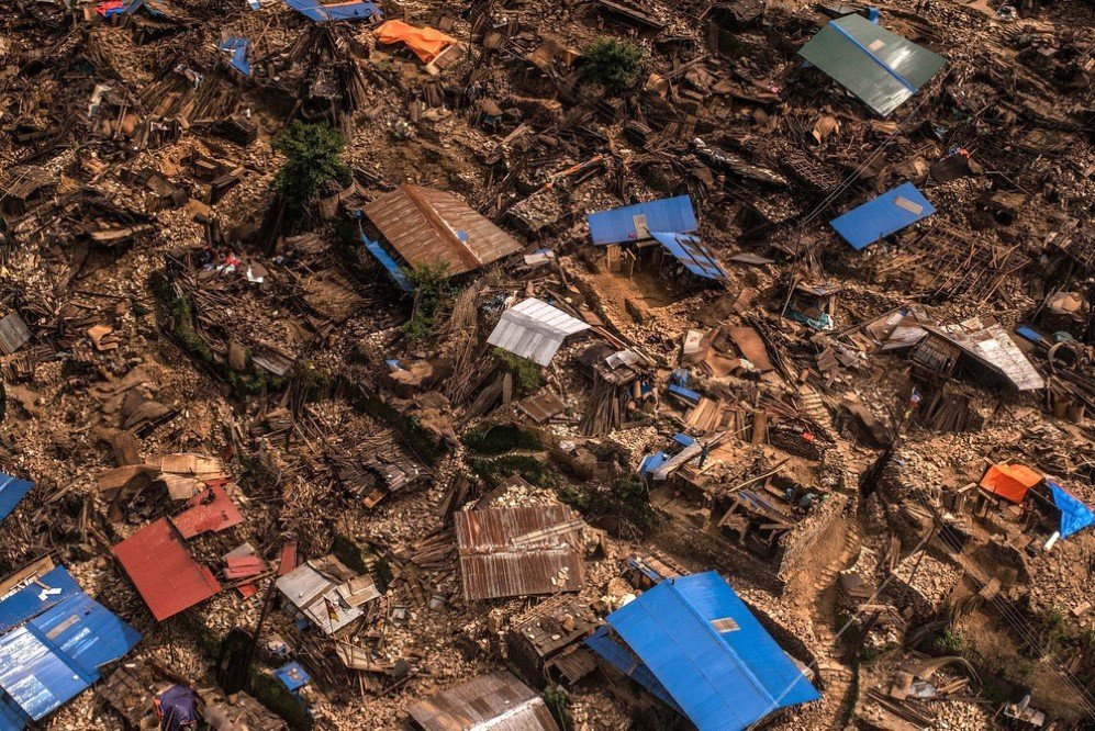 Damaged houses are seen from an Indian Helicopter in Khanigaun, Nepal after a major 7.9 earthquake jolted Kathmandu on April 25. Many houses, buildings, and temples in the capital were destroyed during the earthquake, leaving over 7,000 people dead and many more trapped under the debris.