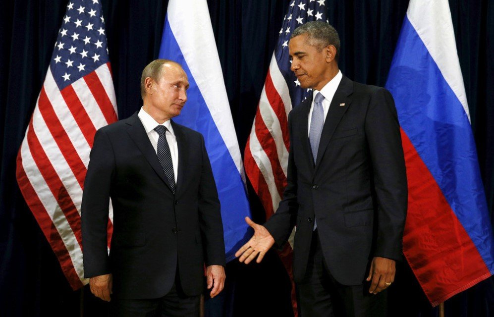 President Barack Obama extends his hand to Russian President Vladimir Putin during their meeting at the United Nations General Assembly in New York City – Sept. 28, 2015