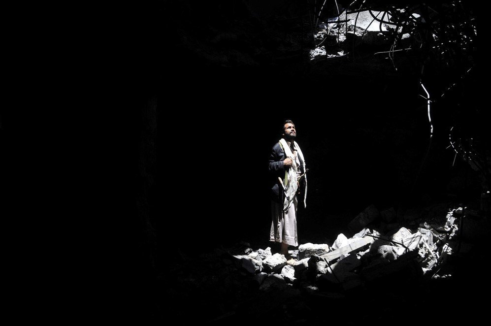 A man look at the rubble of his house in Sanaa, Yemen, after it was destroyed in an airstrike carried out by the Saudi-led coalition – Sept. 9, 2015.