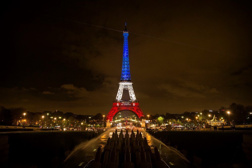 The Eiffel Tower is illuminated in the colors of the French flag to honor the victims of the Paris terror attacks.