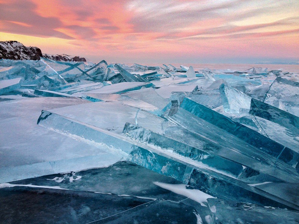 This photo was taken on January 30, 2016, on Olkhon Island, Lake Baikal, Russia. It was the first ice on the lake after heavy frosts below -30C, it is titled, Baikal Ice on Sunset.