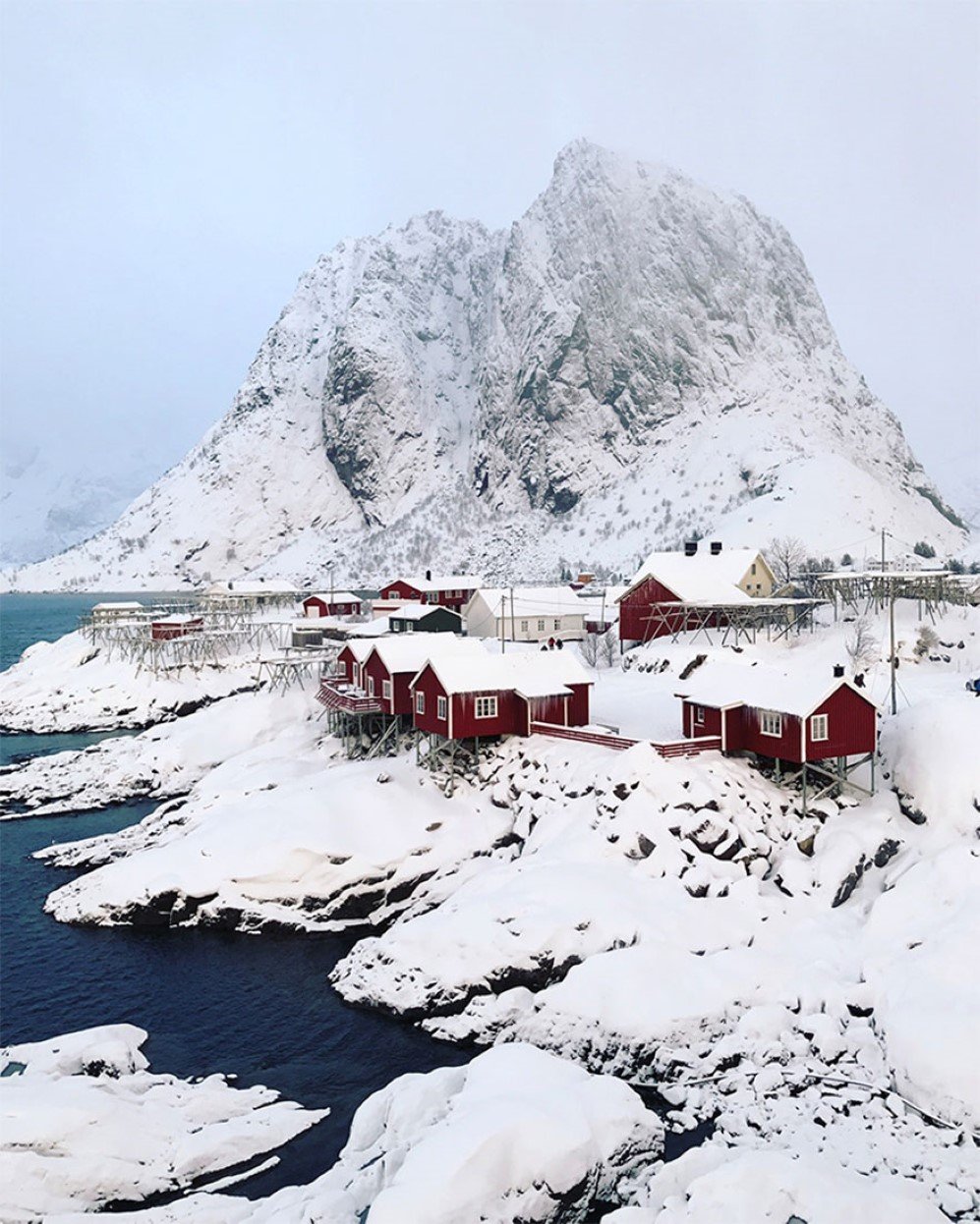 I shot this image on a bridge in Norway’s Lofoten Islands overlooking Reinefjord towards Olstinden. The red cabins are traditional fishing cottages. I try to push myself outside of my comfort zone photographically a few times a year, and this year I headed to the arctic in February. I took this shot just after sunrise during a snowstorm. The colors changed every few minutes, and the snowfall was heavy at times changing the moody dramatically from minute to minute.  It was a classic “wait for the light” situation. It was amazingly atmospheric and beautiful, but very cold and windy. I shot this image using the native camera app on my iPhone 7 plus. The light was beautiful and I and used a touch of the Instagram Clarendon filter, which punched up the blue in the water. I’ve always been a fan of sunsets but photographing sunrise can be just as magical.