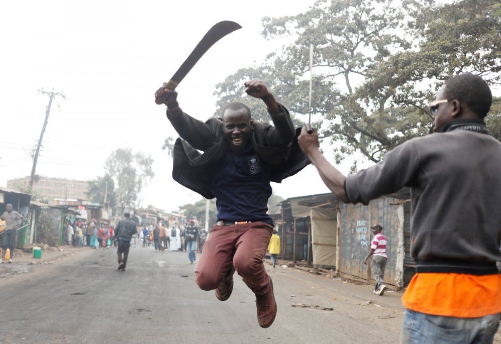 a supporter of opposition leader raila odinga gestures with a machete in kibera slum in nairobi kenya on august 11 2017