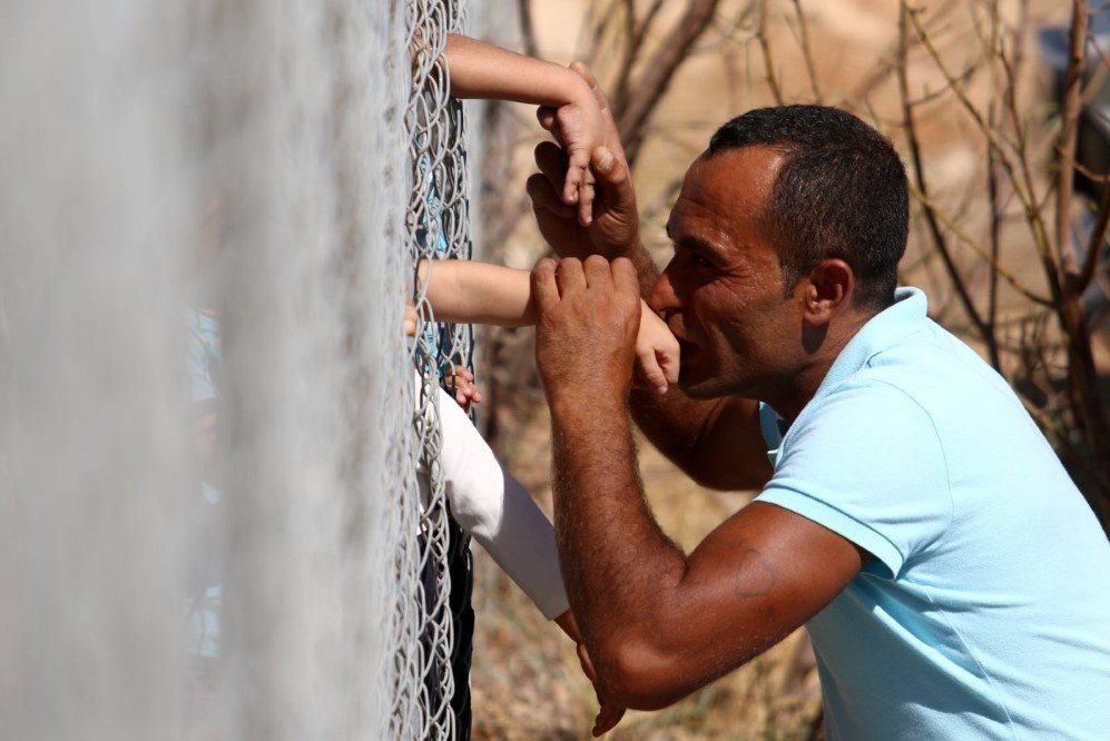 ammar hammasho from syria who lives in cyprus kisses his children who arrived at the refugee camp in kokkinotrimithia outside nicosia cyprus on september 10 2017