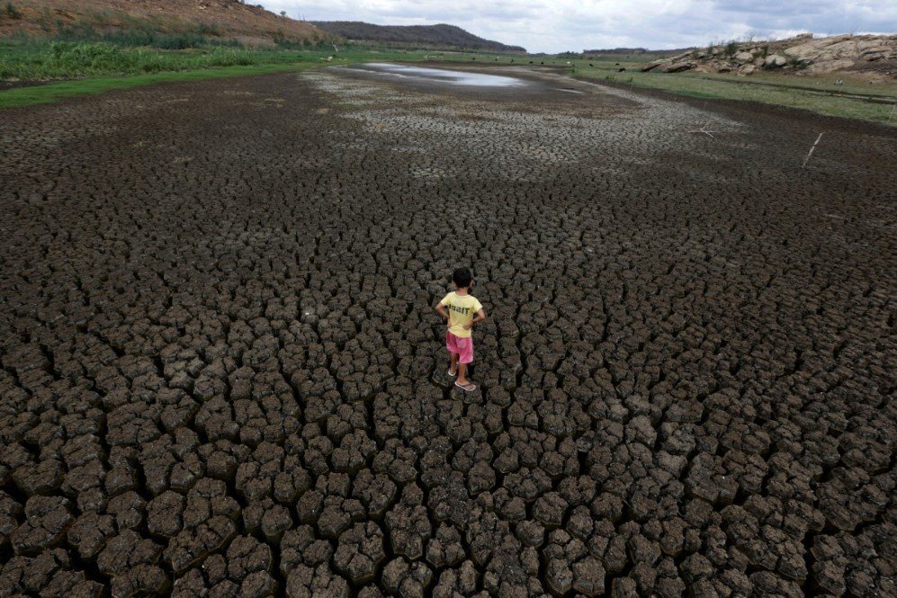 natan cabral 5 stands on the cracked ground of the boqueirao reservoir in the metropolitan region of campina grande paraiba state brazil on february 13 2017