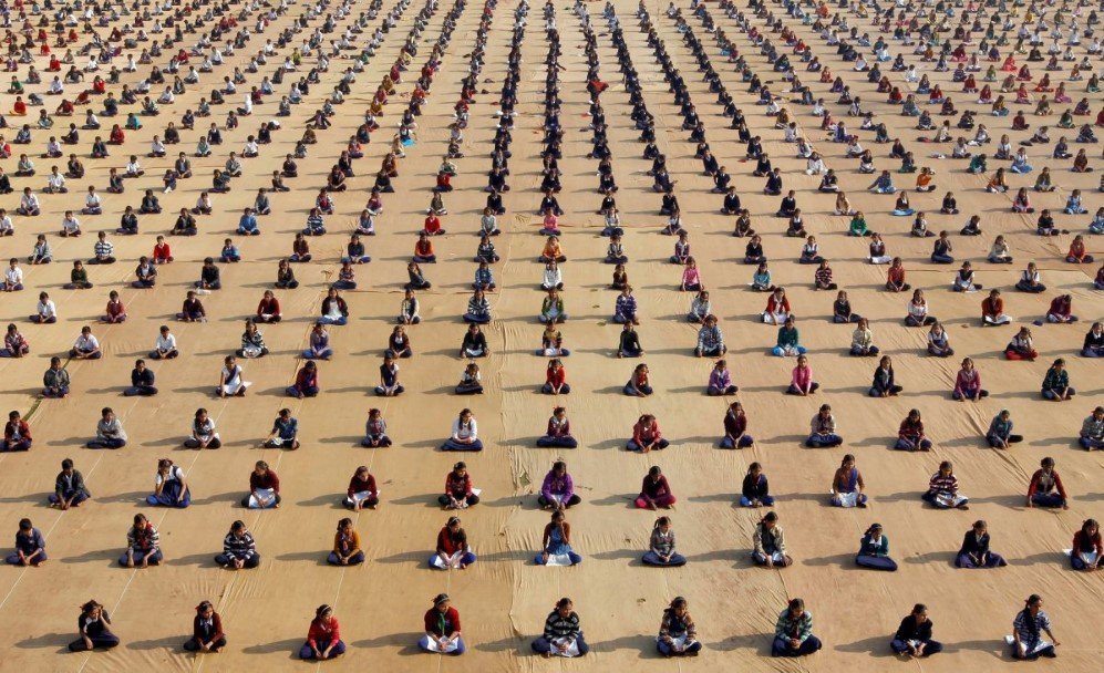 school children attend a yoga session at a camp in ahmedabad india on january 5 2017