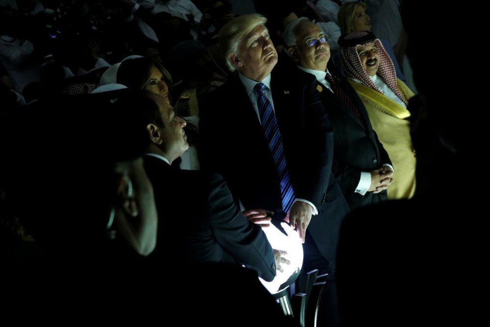us president donald trump and other leaders react to a wall of computer screens coming online as they tour the global center for combatting extremist ideology in riyadh saudi arabia on may 21 2017