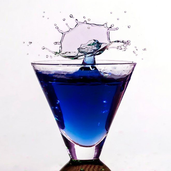 Liquids collide in a glass.
