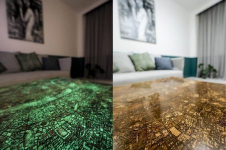 This coffee table features an engraved glowing map on top