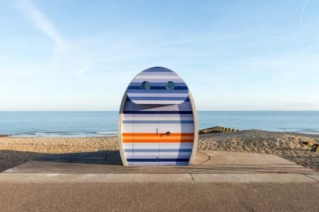 Retro-style beach hut rotates in the direction of sun to catch light all day