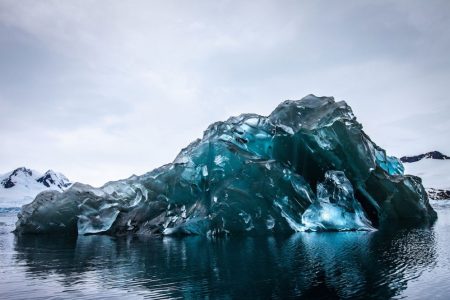 This flipped iceberg features incredibly beautiful blue hues on its underside