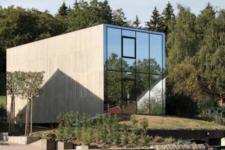 This house has reflective glass as its front facade